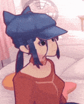 a girl wearing a blue hat with cat ears
