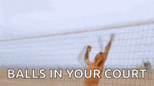 a shirtless man is playing volleyball on the beach with the words balls in your court below him