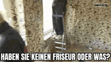 a man is standing on a ladder in a room with a window .
