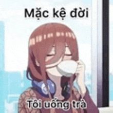 a girl with headphones is drinking a cup of coffee from a cup .