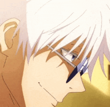 a close up of a person wearing glasses with white hair .