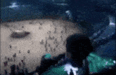 a blurred image of a crowd of people watching a concert