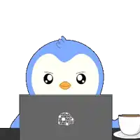 a penguin is sitting in front of a laptop