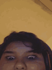 a close up of a person 's face with headphones