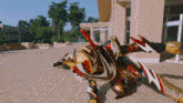 a statue of a dragon with red and white wings