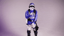 a person wearing a blue and white outfit with the word nike on the shirt