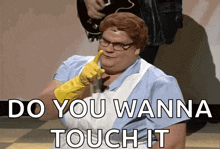a woman wearing a rubber glove says " do you wanna touch it " in front of a man playing a guitar
