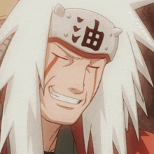 a close up of a man wearing a headband with chinese characters on it