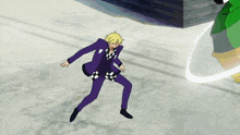 a man in a purple suit is dancing in front of a green object