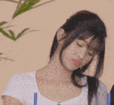 a woman with a straw in her mouth looks at the camera