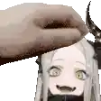 a hand is holding a girl 's head with horns on it .