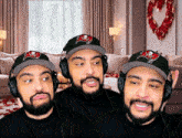 a man wearing a buccaneers hat is making a face