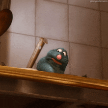 a cartoon rat is sitting on a shelf and looking at the camera with a caption that says ohyesitsmeira