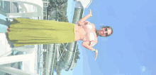 a woman standing in front of a water slide