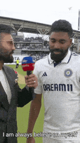 a man in a white shirt that says dream11