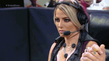 a woman wearing a headset and a ring is on a fox w channel