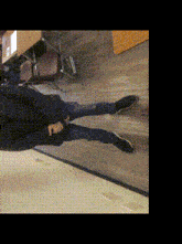 a person laying on the floor with their legs crossed and a chair in the background