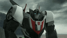 a robot with a red white and black stripe on its chest