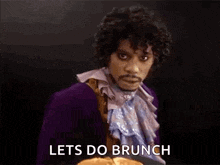 prince is holding a plate of pancakes and saying let 's do brunch .