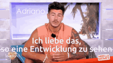a man is sitting in a chair with the words ich liebe das written above him
