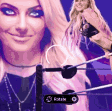 a woman is standing in a wrestling ring with a rotate button in the corner