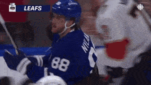 a hockey player with the number 88 on his jersey is on the ice