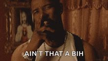 a man with a beard says ain 't that a bih