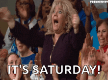a woman in a crowd says it 's saturday in a crowd