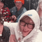 a girl wearing glasses and a white hoodie with the name shua on it