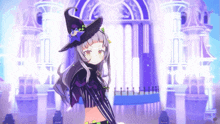 a girl in a witch costume is standing in front of a building