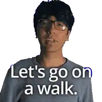 a man wearing glasses and a gray shirt says let 's go on a walk