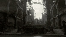 a black and white photo of a ruined building with columns