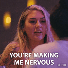 a woman says you 're making me nervous while looking at a man