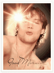 a picture of a shirtless man with the words good morning written on the bottom