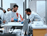 a group of doctors looking at a bloody body