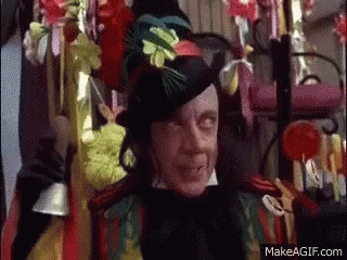 the child-catcher from chitty-chitty bang bang with a top hat and a whole lot of candy