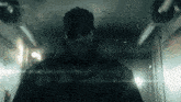 a man in a military uniform is standing in a dark room with konami written on the bottom of the screen