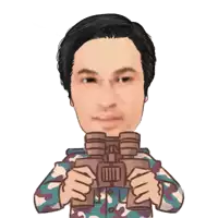 a man in a camouflage shirt is holding binoculars in his hands