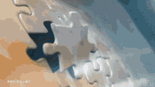 a close up of a puzzle piece with chinese writing on the bottom right