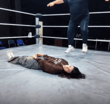 a person laying on the floor with a sweatshirt that says ' iowa ' on the front