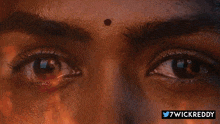 a close up of a person 's eyes with the hashtag 7wickreddy on the bottom