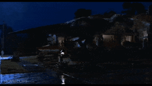 a movie clip from movieclips.com showing a house at night
