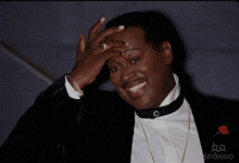 a man in a tuxedo with spokeo written on the bottom of the photo