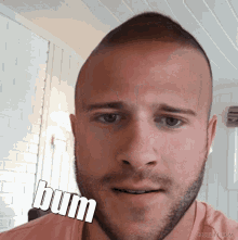 a close up of a man 's face with the words bum written on it