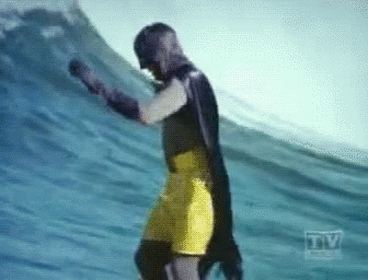 Batman Surfing GIF - Batman Surfing Yellow Short - Discover & Share GIFs