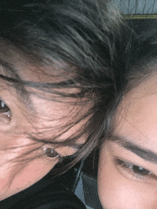 a close up of a person 's face with their eyes closed
