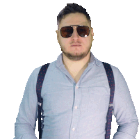 a man wearing suspenders and sunglasses looks to his left