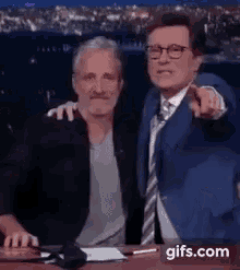 Stephen Colbert Jon Stewart GIF - Stephen Colbert Jon Stewart Hug GIFs