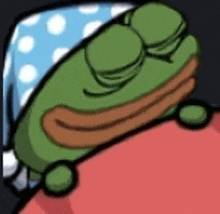 a green frog is sleeping on a bed with a polka dot pillow .