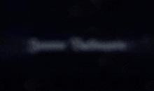 a blurred image of a light coming out of a dark background